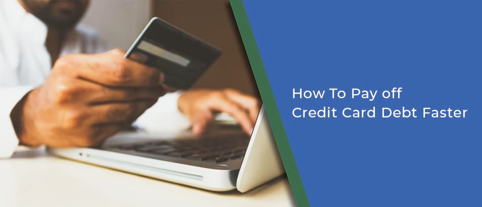 How to Pay off  Credit Card Debt Faster - Image of a person typing on a computer holding their credit card 